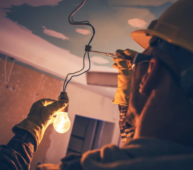 Electrician working on wiring